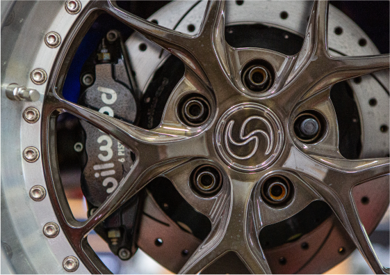 A close up shot of a wheel and its brake