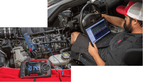 A JBA technician in the drive seat looking a computer with stats