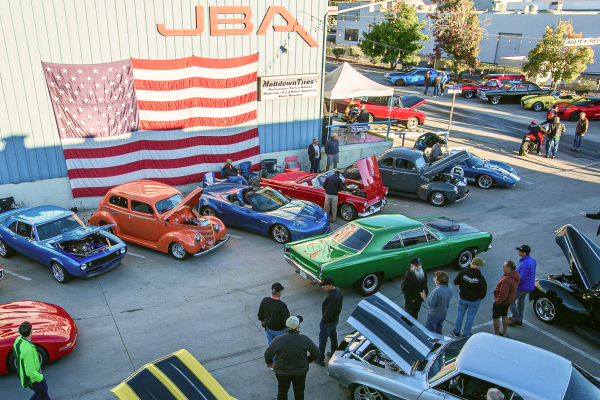 JBA Coffee and Cars event with cars and people having fun in the parking lot