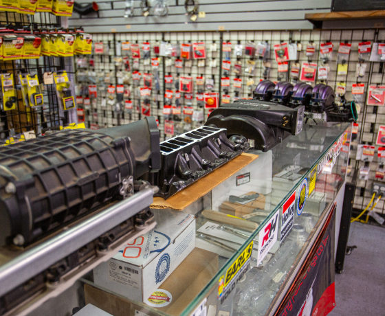Automotive plumbing parts wall display in JBA Speed Shop San Diego