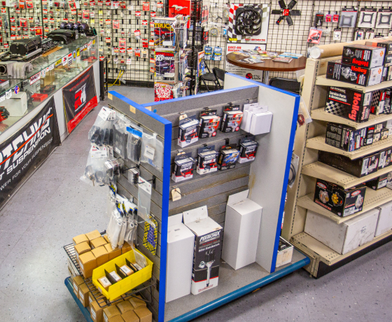 Automotive plumbing parts wall display in JBA Speed Shop San Diego